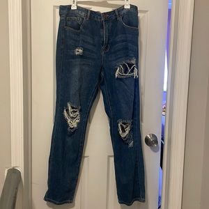 Distressed jeans.Size 30 Forever 21. Loose fitting. Rips & holes . Never worn